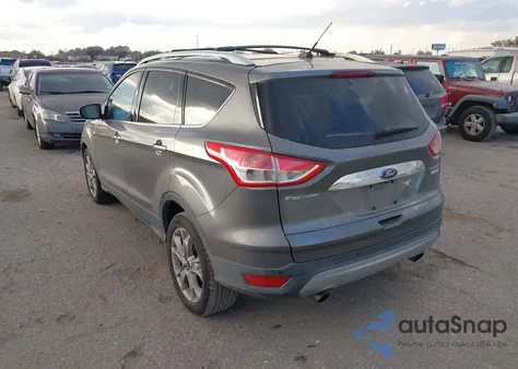 2014 Ford Escape Titanium z USA, uszkodzony, nr VIN 1FMCU0J9XEUD29721